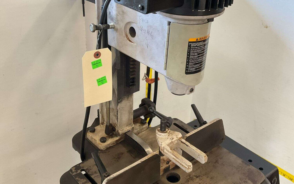 Delta hollow chisel mortising machine for precision woodworking joinery with adjustable table and clamping system